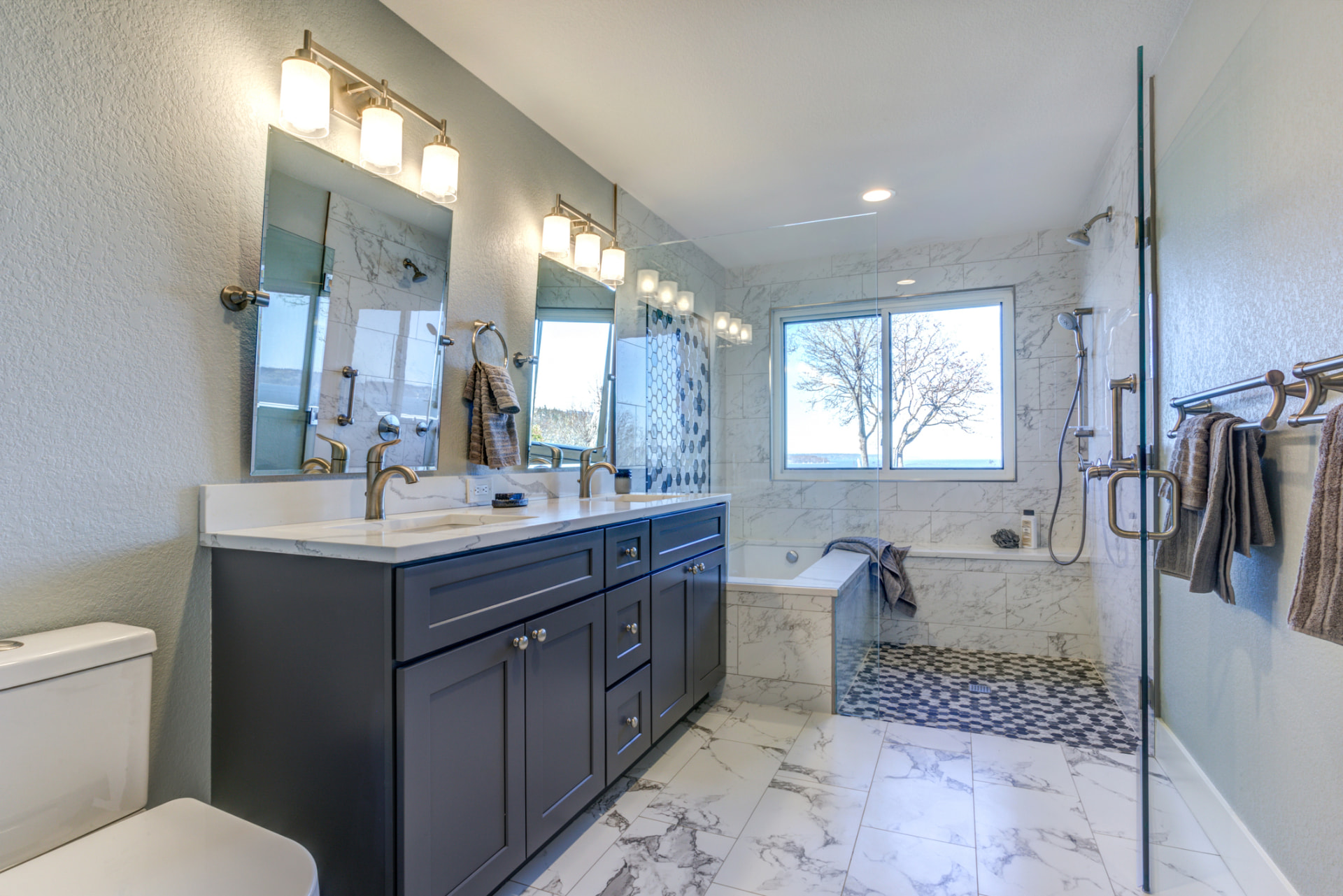 Master bathroom remodel with double vanity and soaking tub in Las Olas, FL