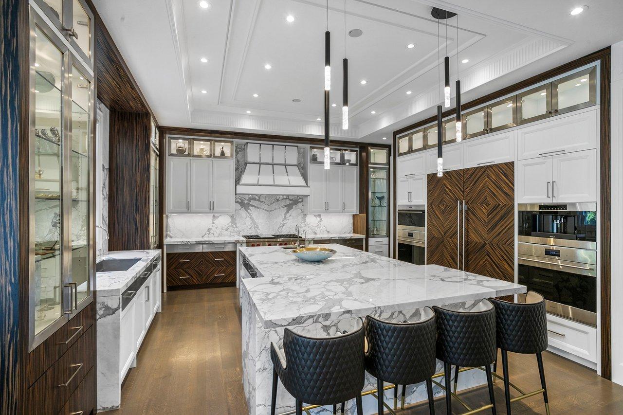 Luxury Aventura kitchen remodel with marble island and custom cabinetry