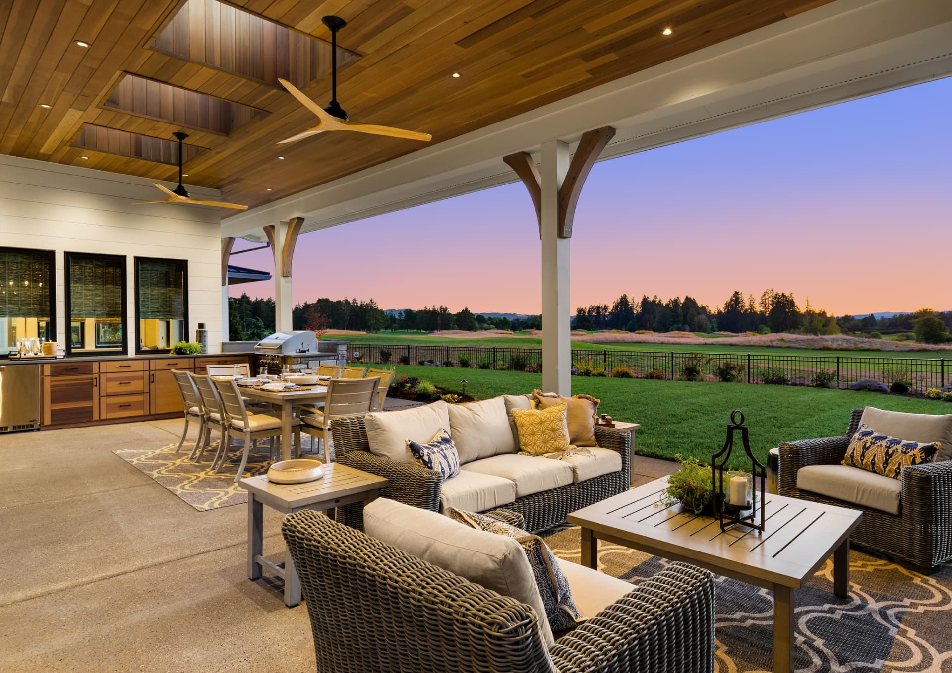 Covered outdoor living space with kitchen and lounge in Pinecrest, FL