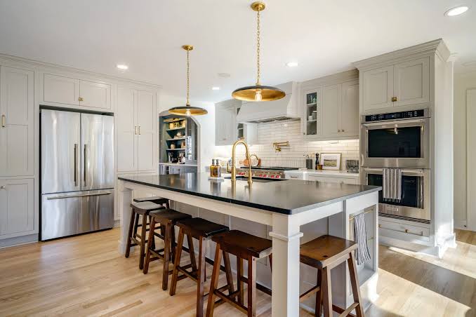 Licensed contractor reviewing permit documents with homeowners in Aventura