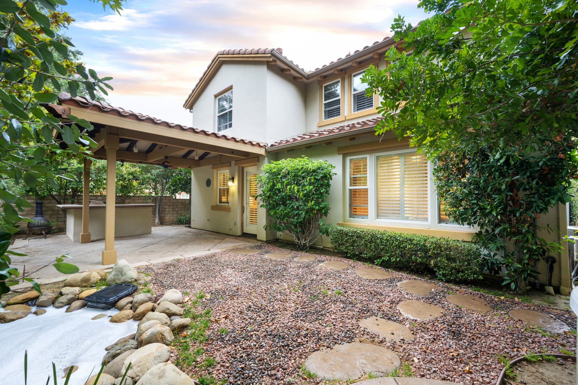 Covered patio and backyard hardscape renovation in Jupiter, FL