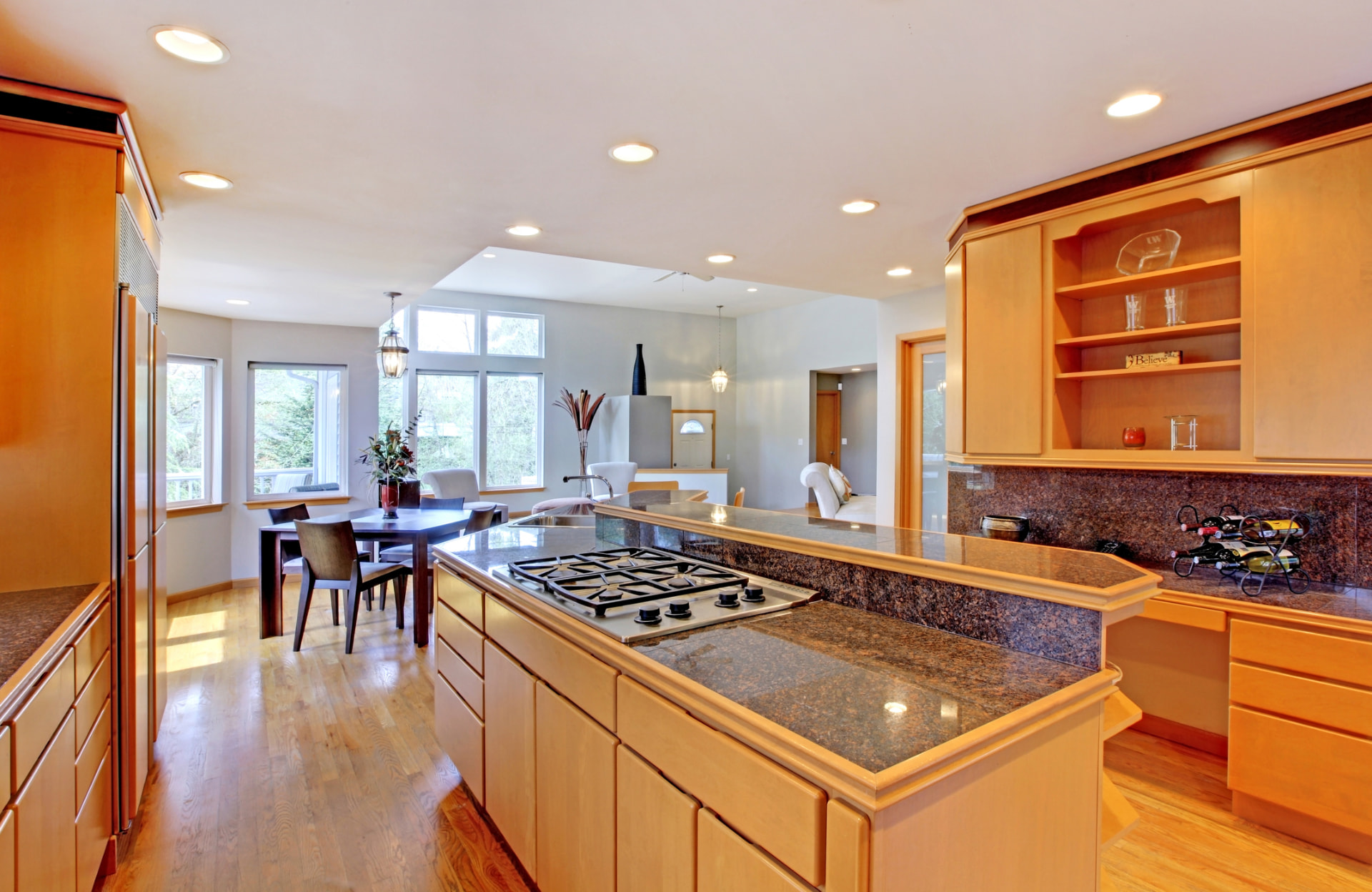Open-concept kitchen renovation with granite counters in Palm Beach, FL