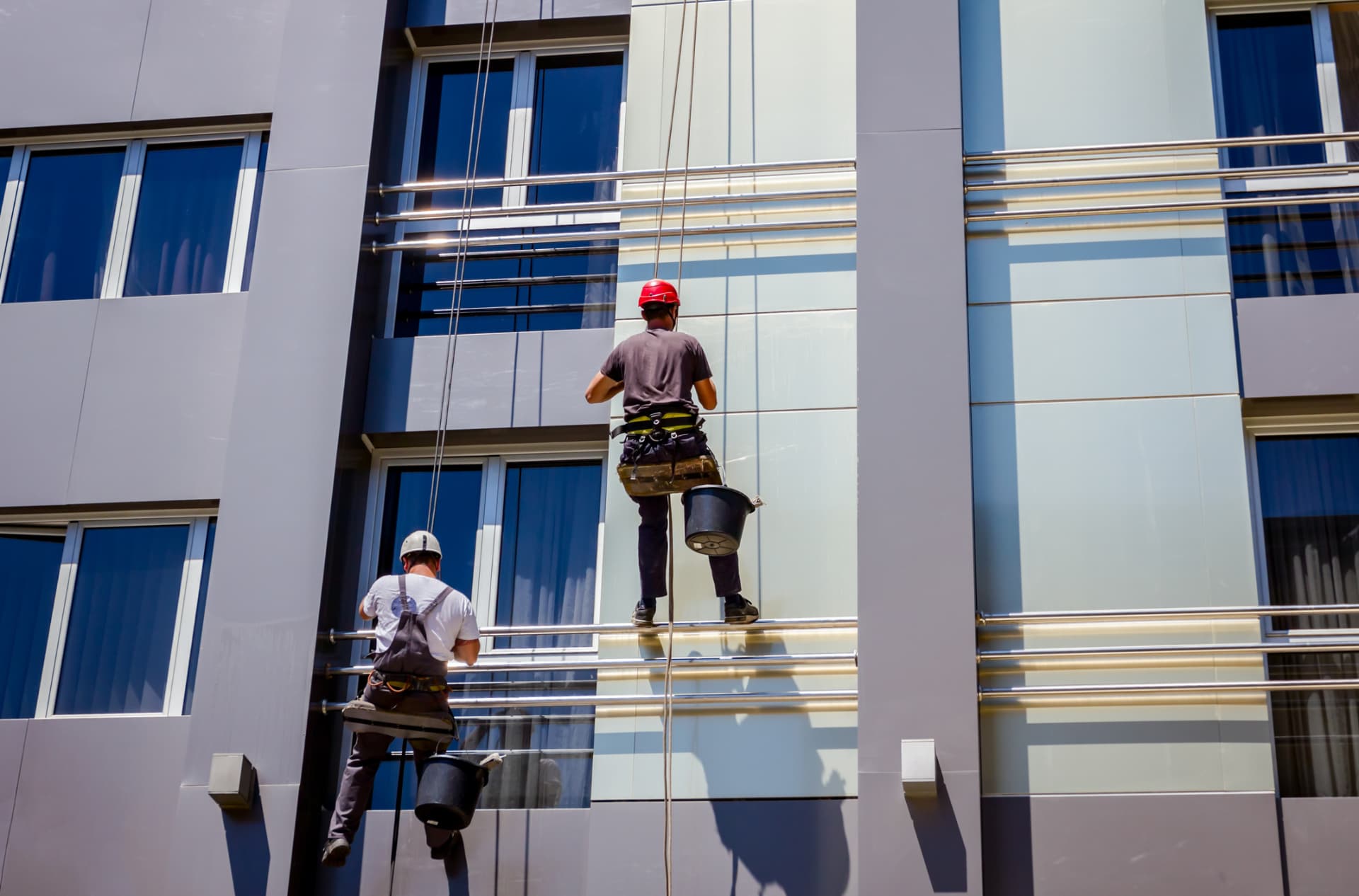 Exterior facade restoration crew working on a building in Hollywood, FL
