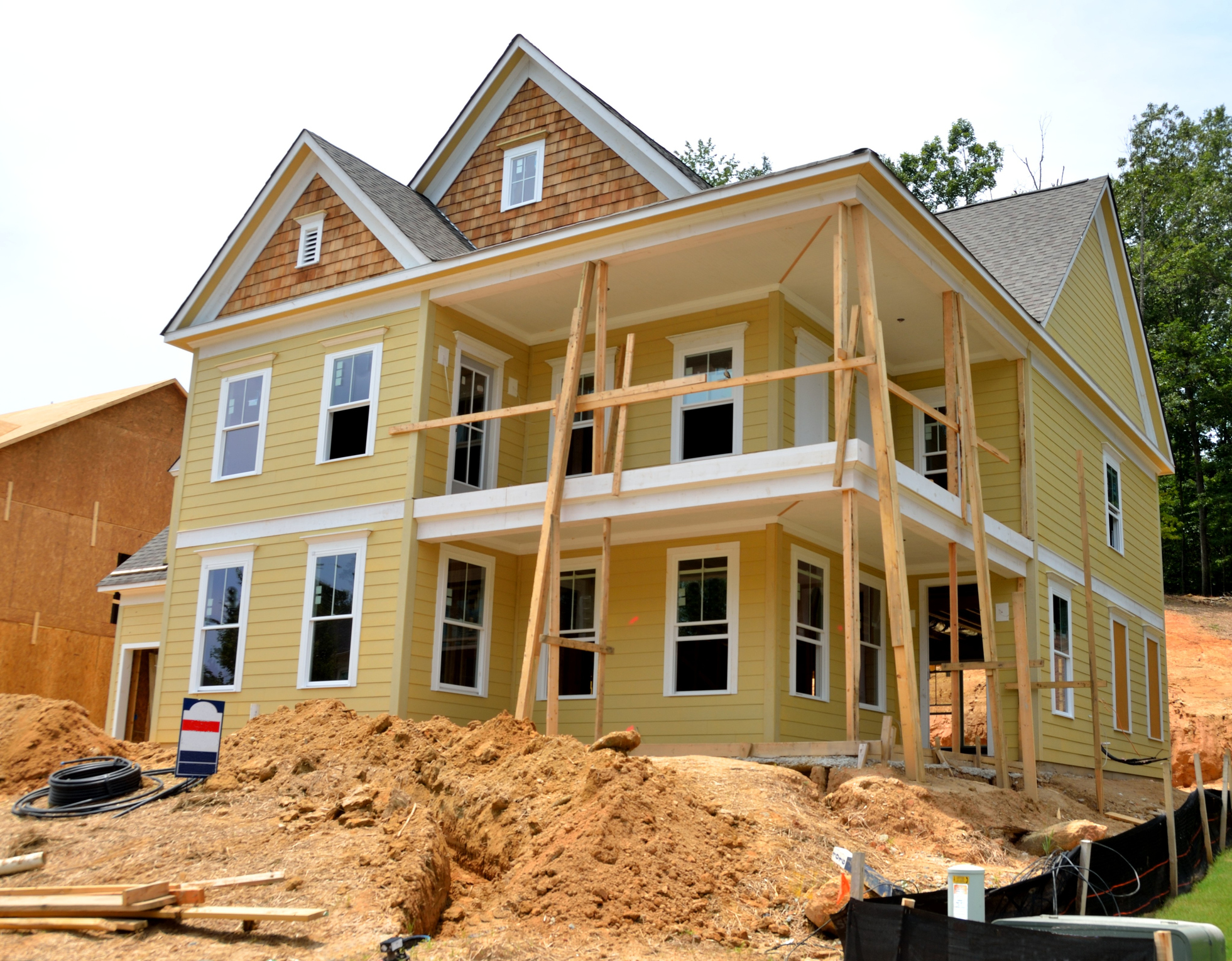 New two-story home construction with wraparound porch in Surfside, FL