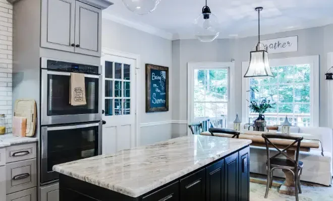 Sunny Isles kitchen island topped with a light luxury stone countertop