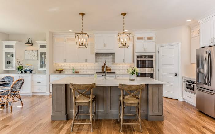 Contractor measuring countertops during an Aventura kitchen renovation
